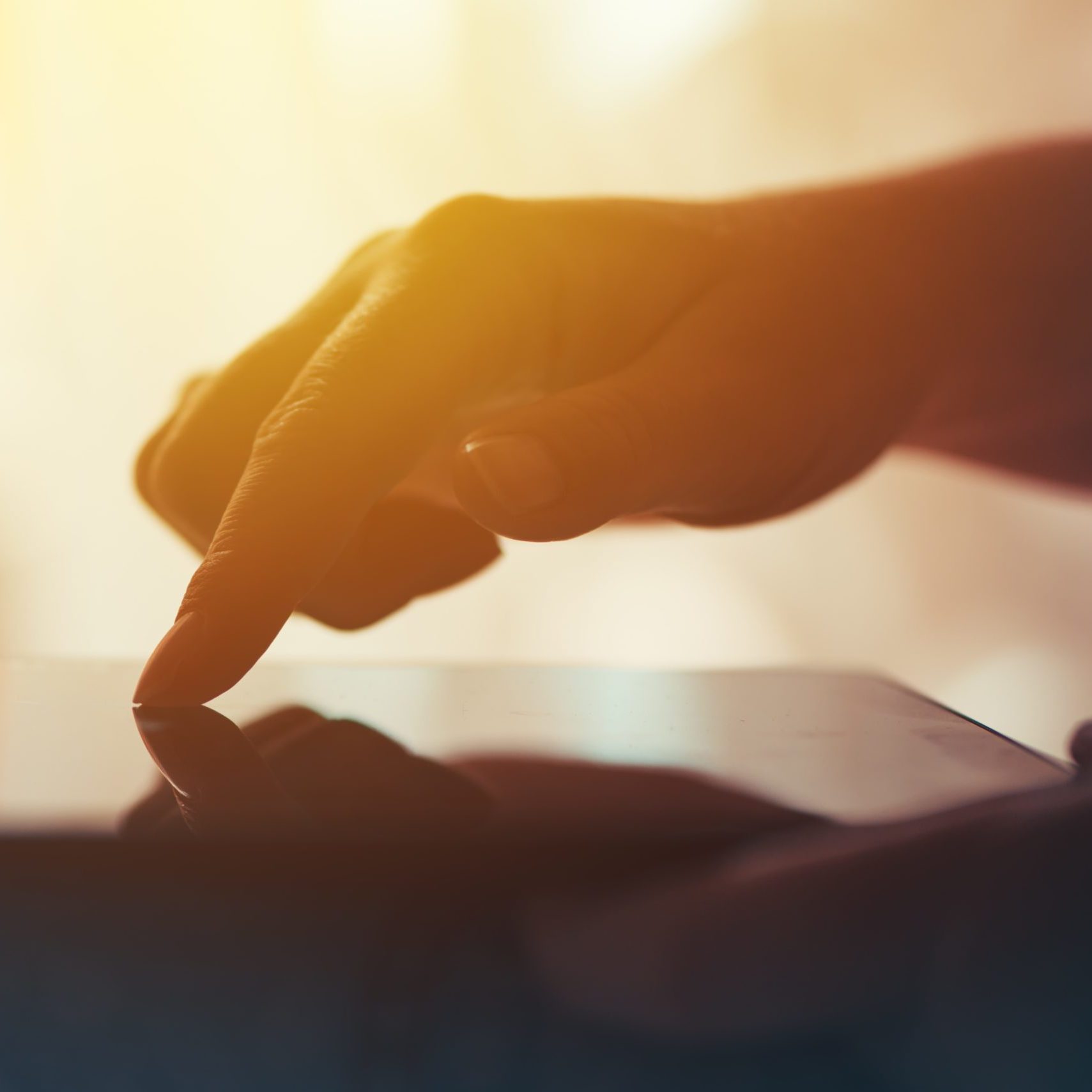 bigstock--209338303 Close up of female hand and finger pushing digital tablet touch screen. Woman using modern electronics for internet browsing. Lifestyle and technology concept.